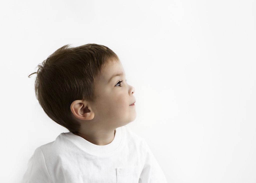 Little boy in white t-shirt side profile by Flower Mound photographer.