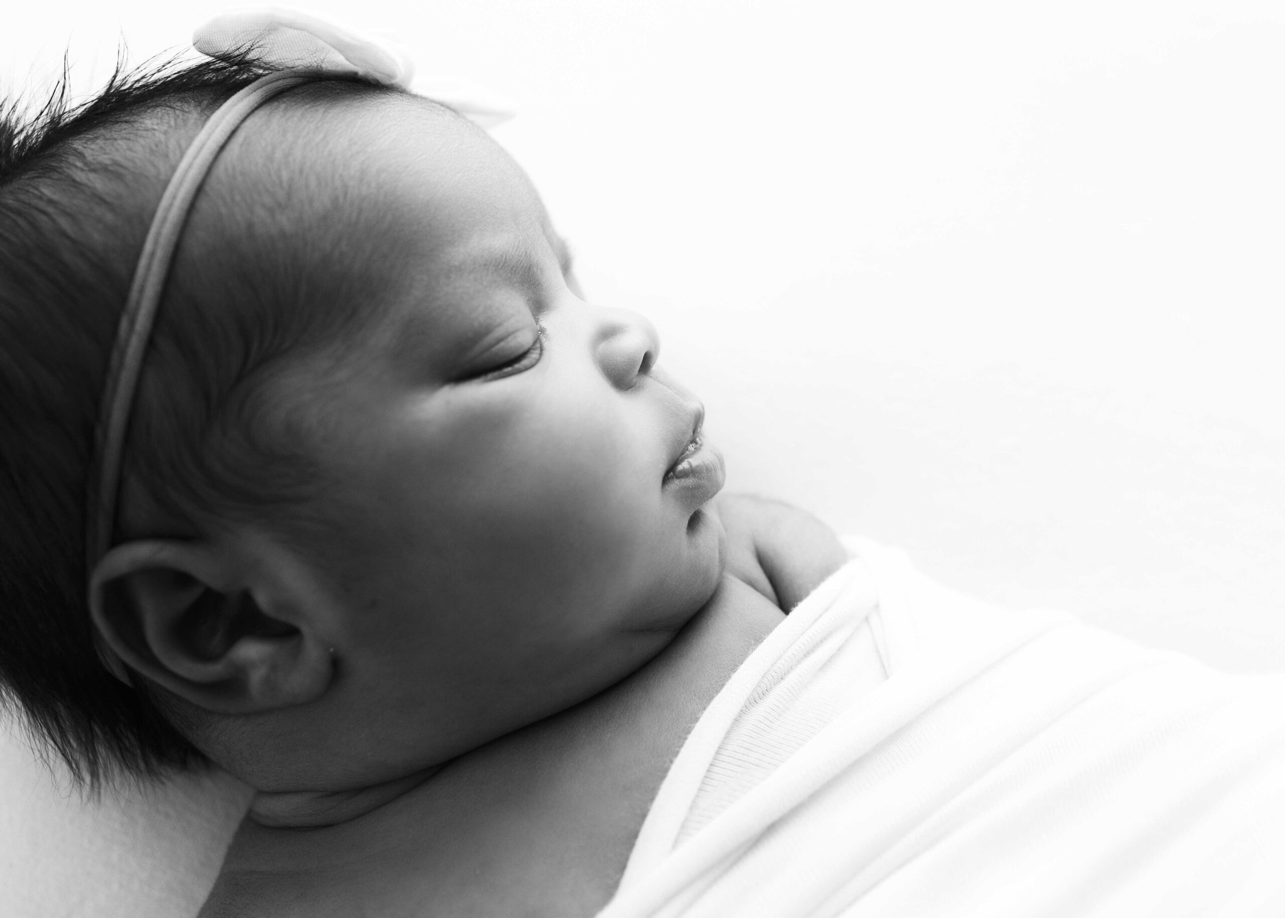 Newborn baby profile while she's sleeping for Dallas birthing centers