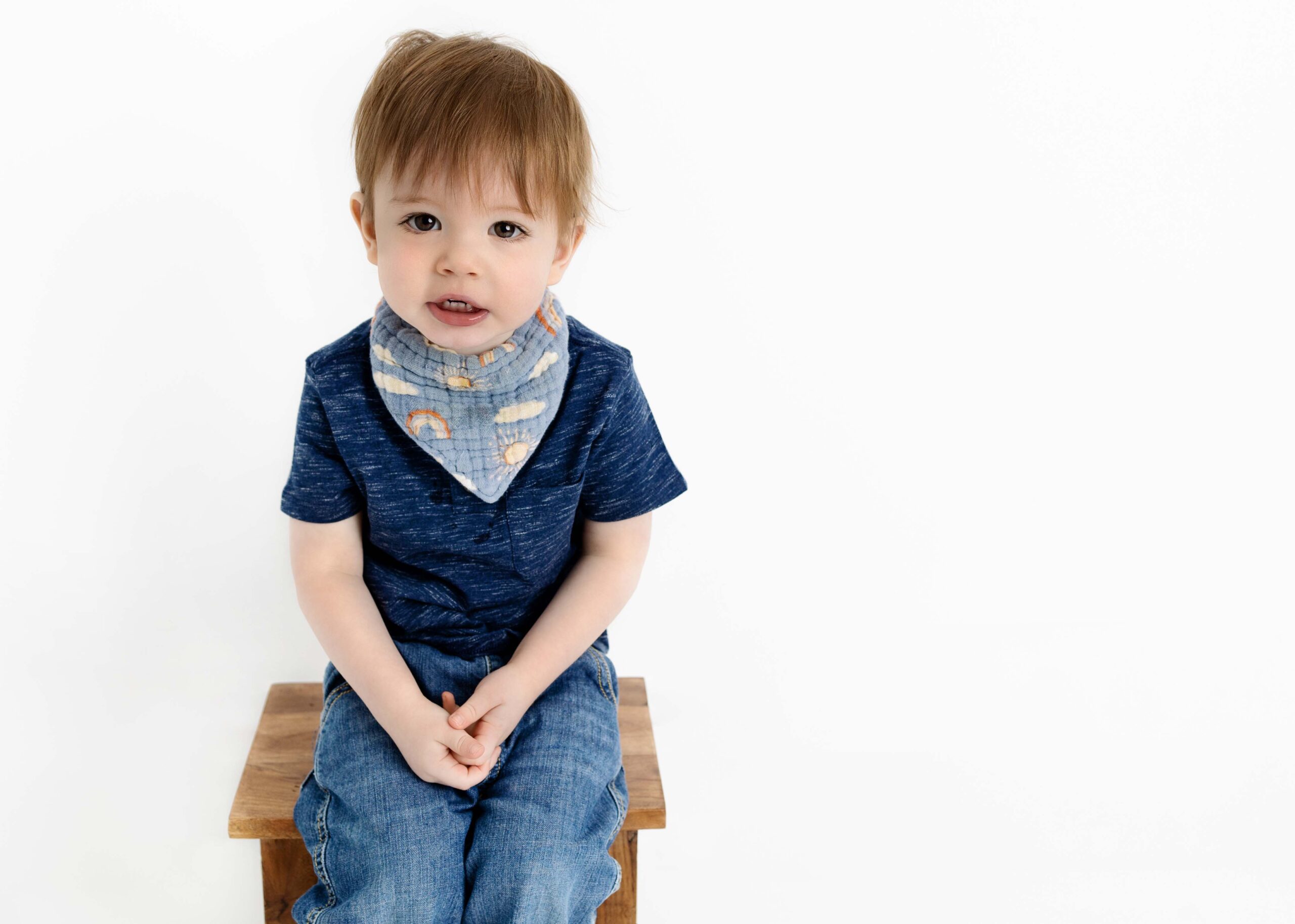 Little boy sitting on a wooden stool by Dallas Children Photographer