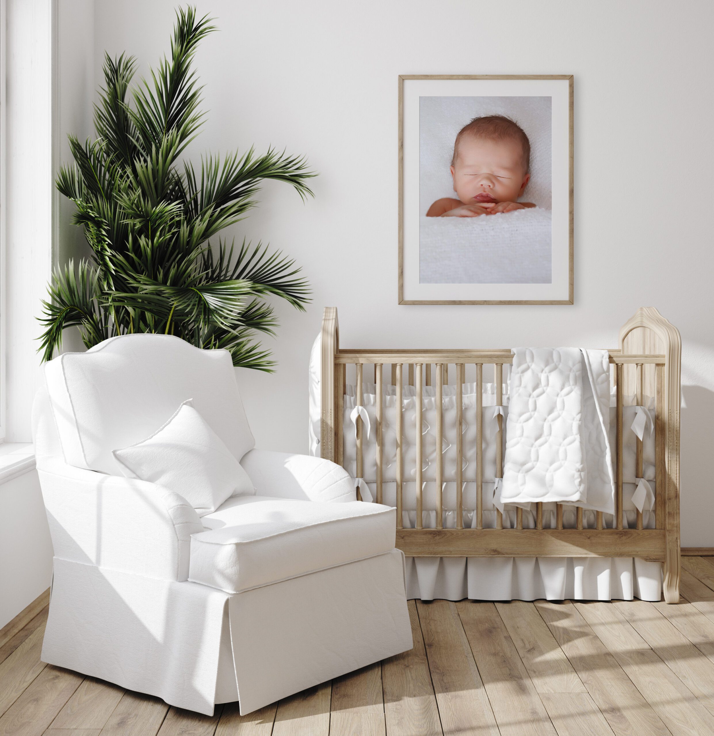 Framed newborn photography in nursery