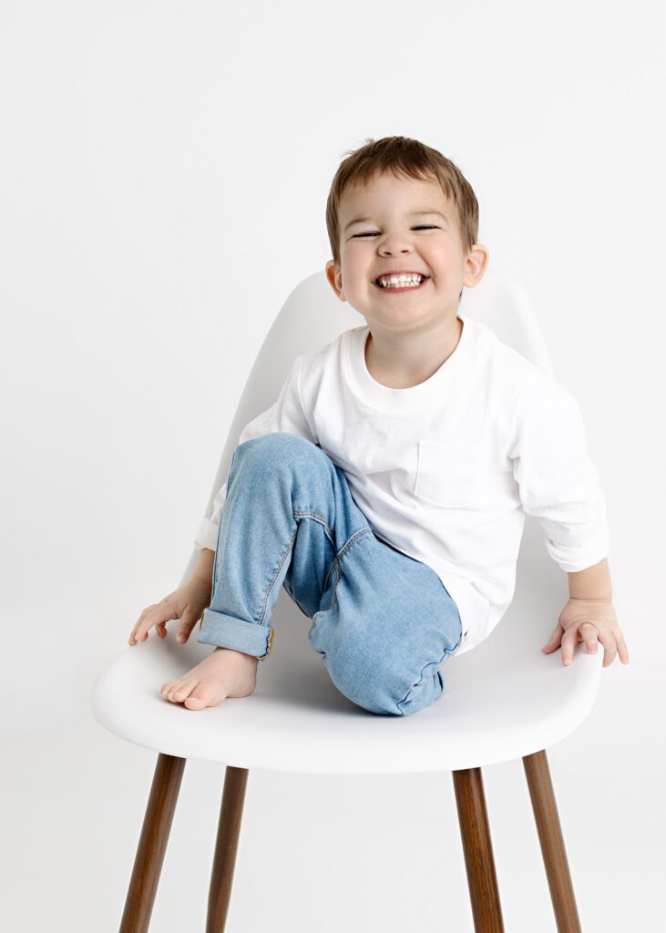 toddler boy with a big smile at the camera