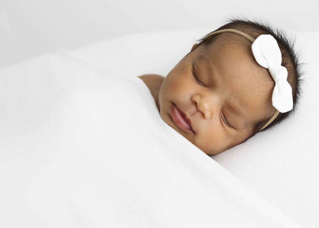 Newborn girl sleeping by newborn photography dallas tx