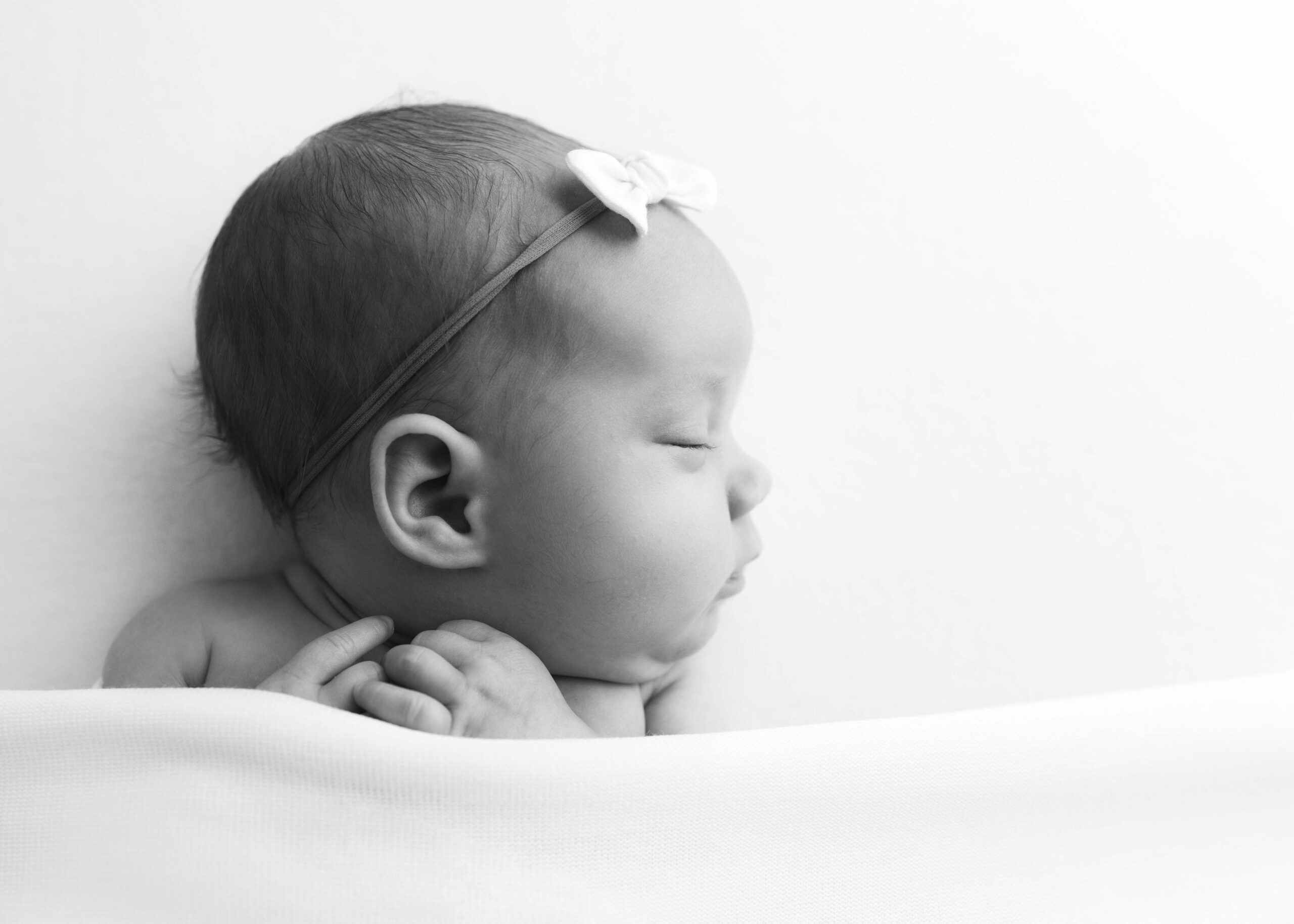 Newborn baby girl sleeping by newborn photography Dallas TX