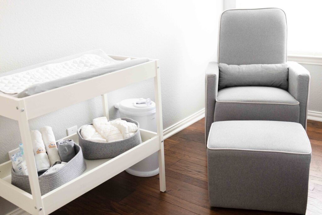 Diaper changing table and feeding chair in a bedroom