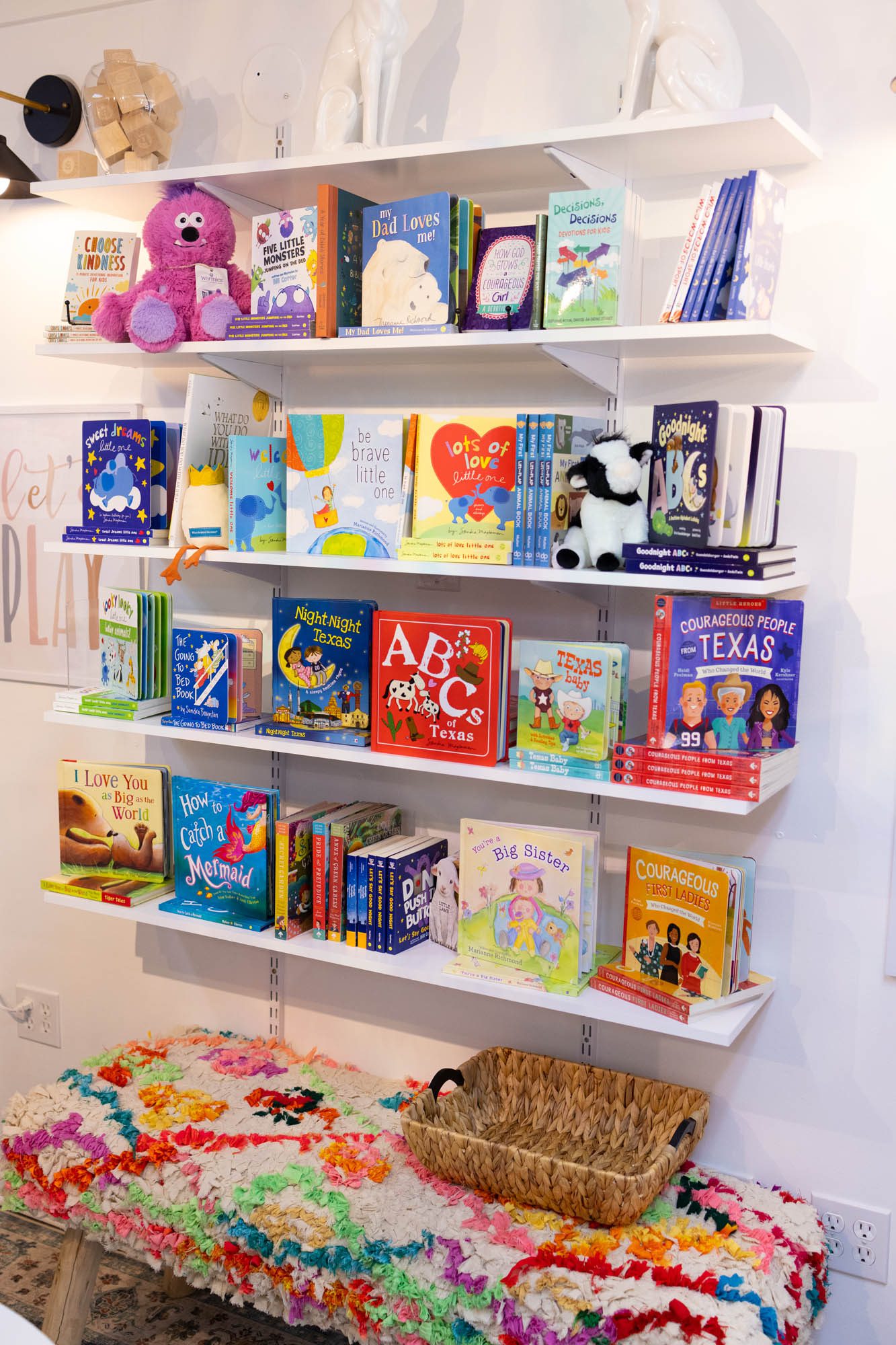 Shelves of kids books in a children's boutique