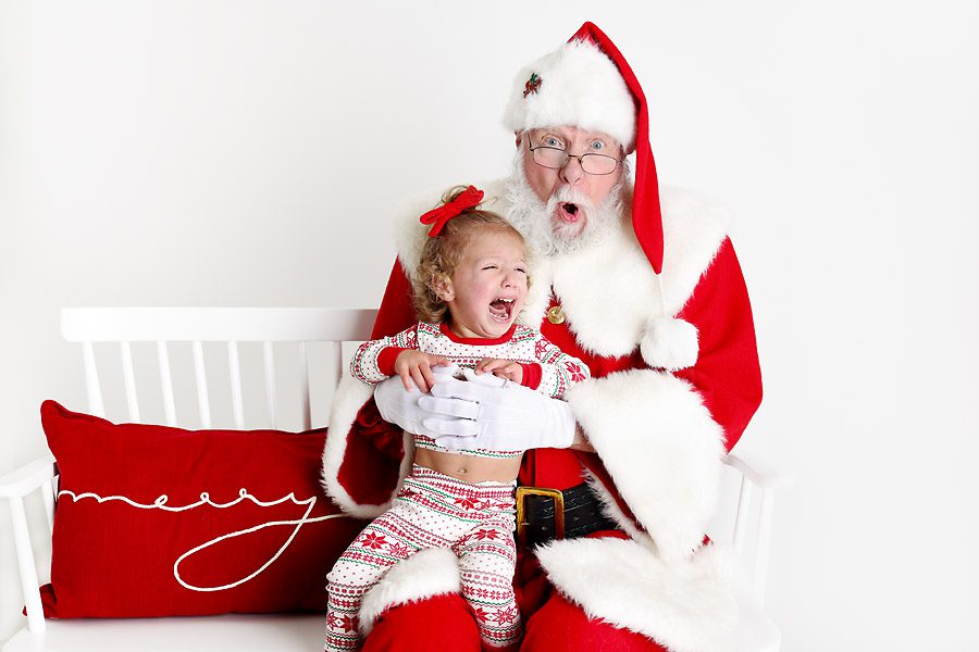 Little girl crying with Santa for pictures with Santa Dallas TX